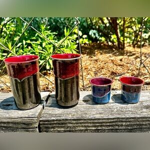 Signed Stuart pottery.  Set of 2 tumblers and 2 tealight holders.